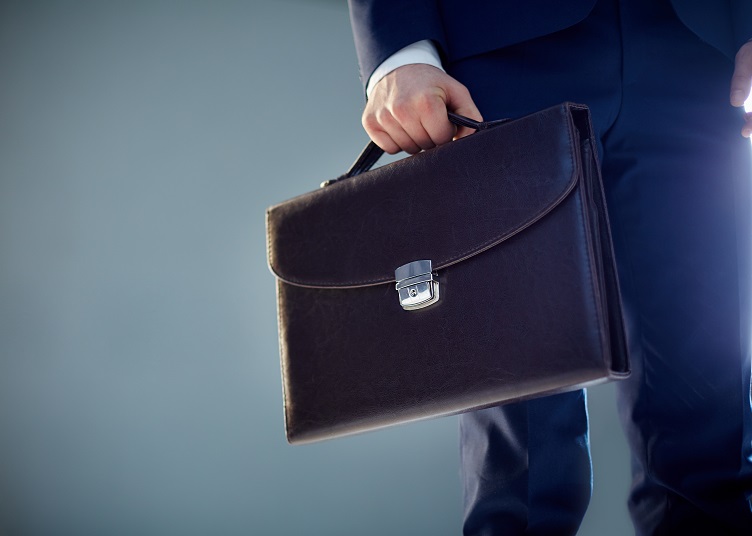Isolated image of a businessman carrying a briefcase
